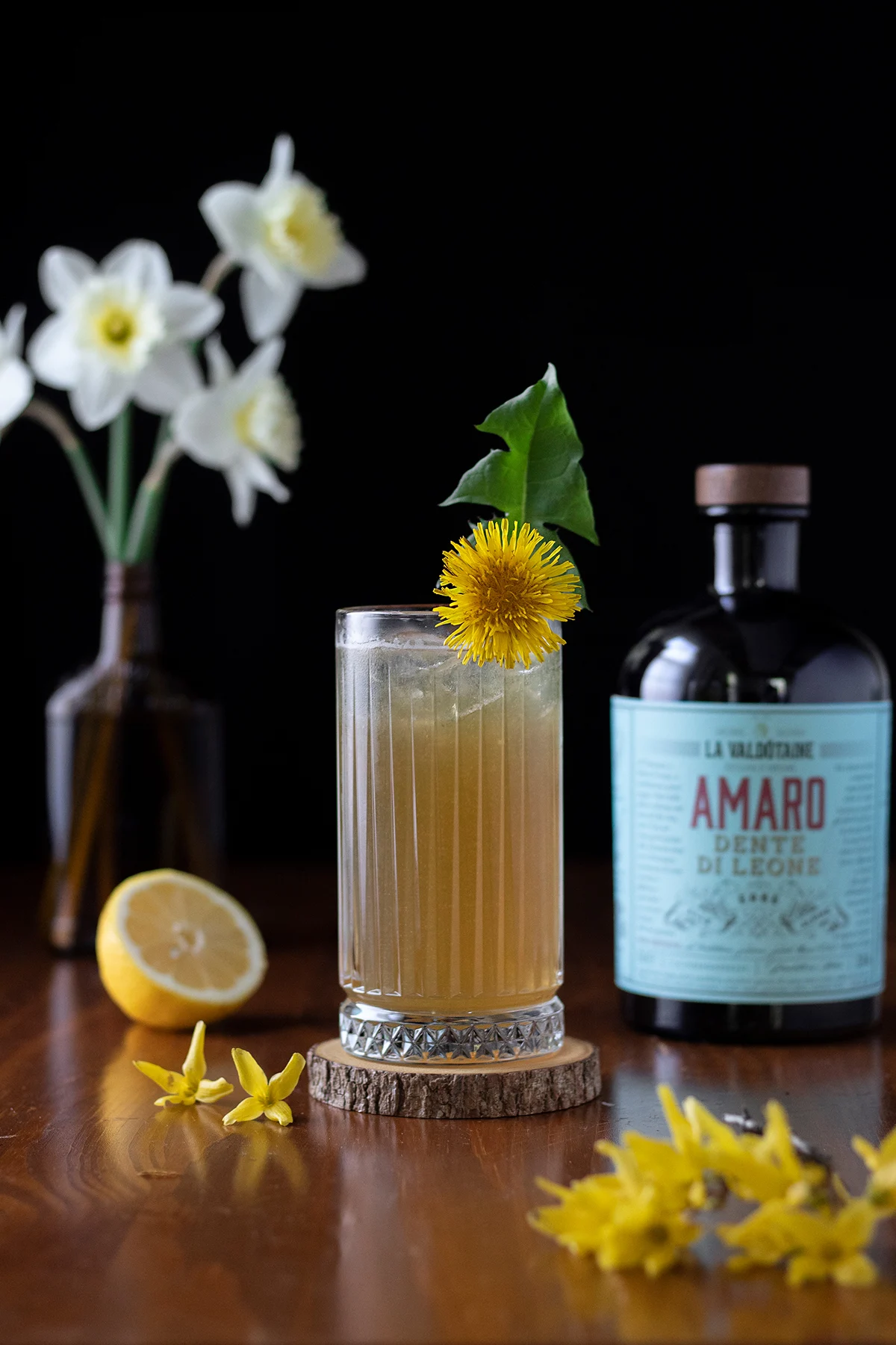 a-tall-brown-drink-garnished-with-a-dandelion